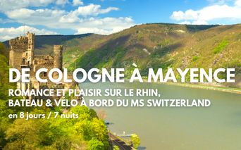 Château médiéval sur les rives du Rhin avec collines vertes en arrière-plan. Voyage vélo et bateau MS Switzerland de Cologne à Mayence.